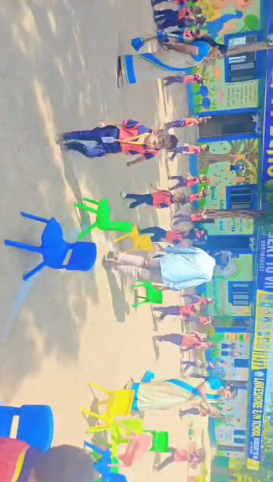 Students and teachers interacting in the campus yard